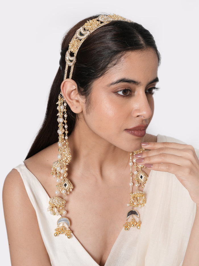 Mokshika Mirror Ethnic Hairband handcrafted with crescent mirror motifs, faux pearls, intricate glass bead embroidery, cascading tassels, and a Gold Tone Finish, perfect for Haldi, Mehndi, Sangeet, weddings, receptions, destination weddings, and elegant bridal hairstyles.
