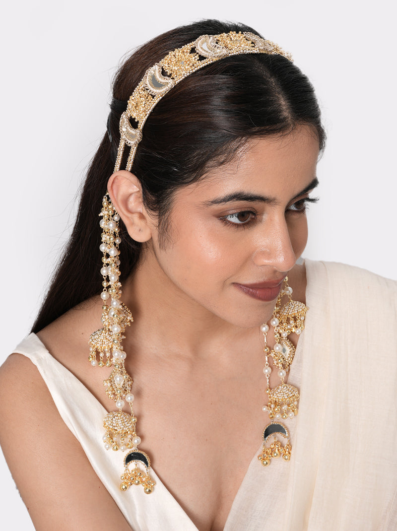 Mokshika Mirror Ethnic Hairband handcrafted with crescent mirror motifs, faux pearls, intricate glass bead embroidery, cascading tassels, and a Gold Tone Finish, perfect for Haldi, Mehndi, Sangeet, weddings, receptions, destination weddings, and elegant bridal hairstyles.