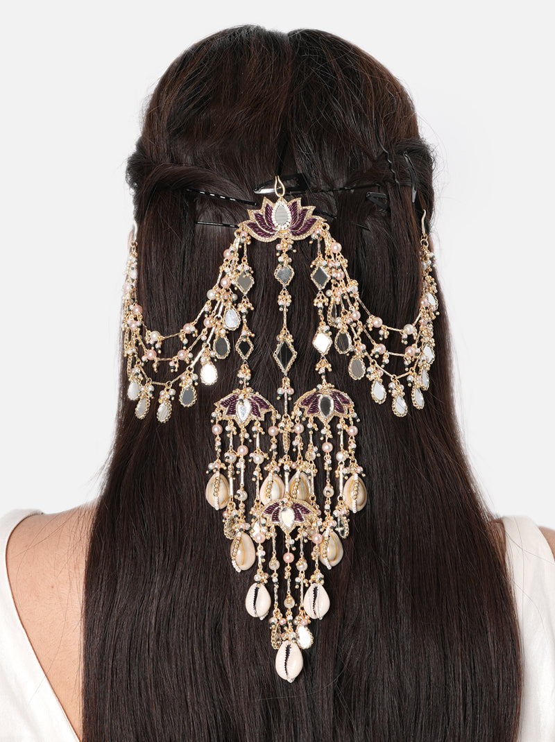 Muskan Lotus Hair Accessory handcrafted with lotus motifs, mirror accents, natural shells, faux pearls, cascading glass bead chains, and a Gold Tone Finish, perfect for bridal entries, Haldi, Mehndi, Sangeet, weddings, receptions, and luxurious bridal hairstyles.