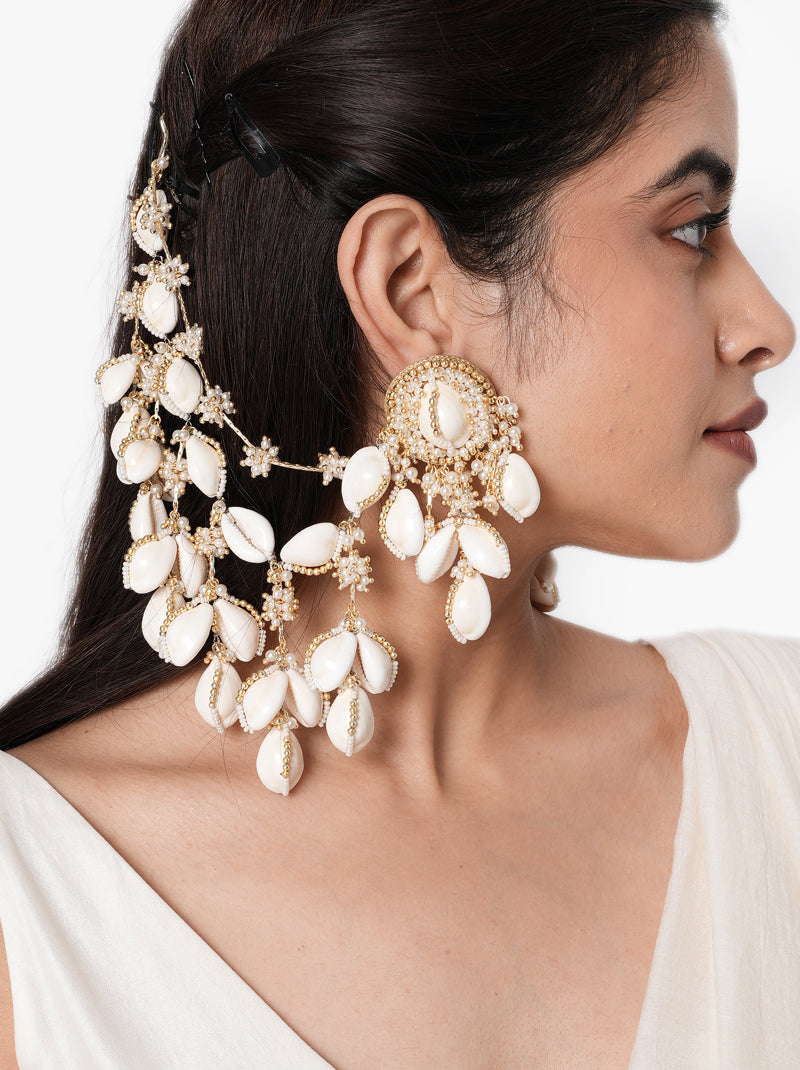 Naina Bridal Shell Earchain handcrafted with natural shell motifs, faux pearls, intricate glass bead embroidery, cascading floral chains, and a Gold Tone Finish, perfect for Haldi, Mehndi, Sangeet, destination weddings, receptions, and luxury bridal styling.