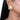 Nehal Shell Stud Earrings featuring an ivory white shell centre, pearl accents and intricate gold-tone beadwork, styled on a woman.