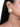 Nehal Shell Stud Earrings featuring an ivory white shell centre, pearl accents and intricate gold-tone beadwork, styled on a woman.