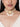Netra Shell Designer Choker handcrafted with natural cowrie shells, faux pearls, glass bead embroidery, and a Gold Tone Finish, featuring an elegant statement centerpiece with cascading shell drops, perfect for Haldi, Mehndi, weddings, receptions, bridal wear, and festive occasions.