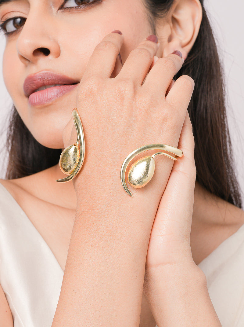 Noa Modern Statement Cuff handcrafted in premium brass featuring a sculptural open cuff design with a polished organic centerpiece and luxurious Gold Tone Finish for contemporary statement styling.