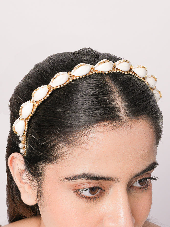 Orina Shell Bridal Hairband featuring handcrafted shell motifs, pearl embellishments, intricate bead embroidery, and gold tone detailing, designed for bridal hairstyles, wedding celebrations, festive occasions, destination weddings, and luxury ethnic fashion styling.