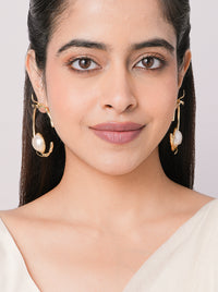 Handcrafted Panda Pearl Hoop Earrings featuring a twisted gold tone hoop design with a faux pearl accent for contemporary statement styling.