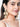 Prerita Shell Embroidered Earrings featuring handcrafted shell motifs, pearl embellishments, intricate thread embroidery, bead detailing, and gold tone finish, perfect for bridal jewelry, festive styling, wedding celebrations, and contemporary ethnic fashion.