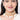 Rakshika Bridal Shell Choker featuring layered faux pearls, cowrie shell drops, intricate gold tone beadwork and handcrafted detailing for bridal and festive wear.
