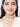 Rakshika Bridal Shell Choker featuring layered faux pearls, cowrie shell drops, intricate gold tone beadwork and handcrafted detailing for bridal and festive wear.