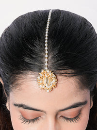 Handcrafted shell pearl maang tikka featuring cowrie shells, pearl embellishments and gold-tone detailing for bridal and festive styling.