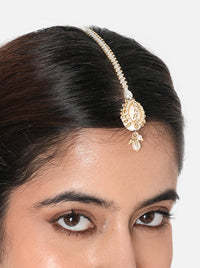 Rashmi Shell Festive Maangtika handcrafted with a natural cowrie shell centerpiece, faux pearls, glass bead embroidery, and a Gold Tone Finish, perfect for Haldi, Mehndi, intimate weddings, festive celebrations, poojas, and elegant bridal styling.