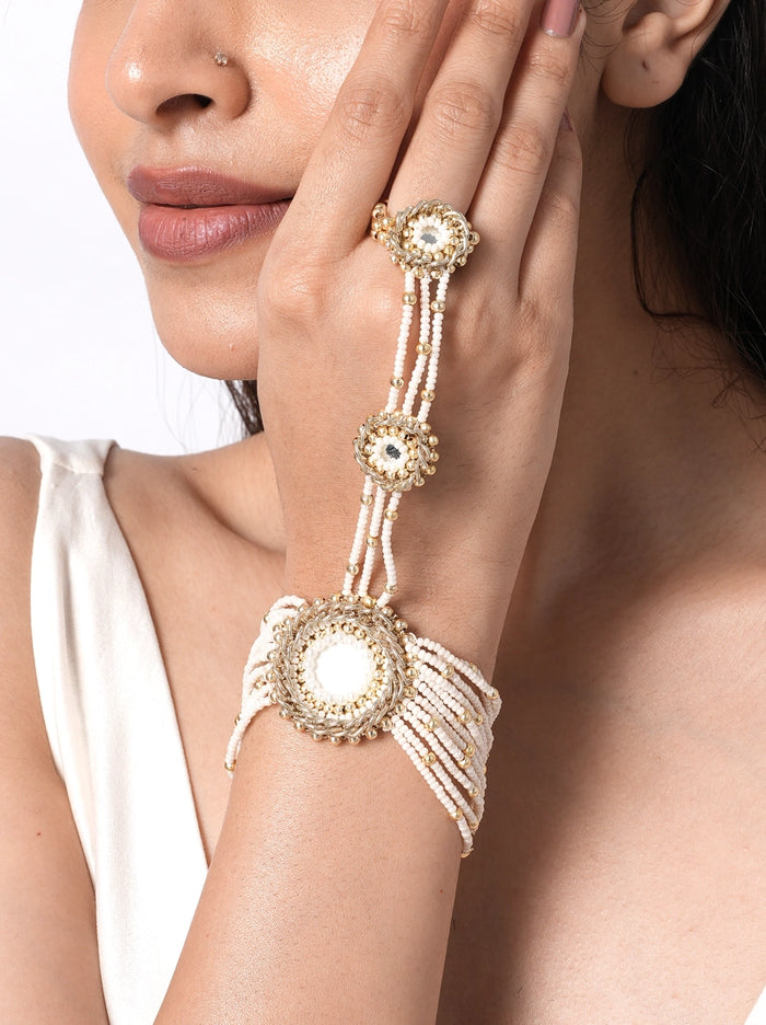 Roop Handcrafted Royal Haathphool handcrafted with faux pearls, glass beads, thread detailing, and brass metal in a Gold Tone Finish, featuring layered beaded strands with ornate circular motifs, perfect for weddings, mehendi, haldi ceremonies, festive occasions, and elegant bridal styling.