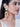 Roya Floral Handcrafted Earringsfeaturing handcrafted floral embroidery, faux pearls, glass stone centerpiece, cascading bead clusters, and elegant Gold Tone Finish for festive and bridal wear.