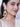 Roya Floral Handcrafted Earringsfeaturing handcrafted floral embroidery, faux pearls, glass stone centerpiece, cascading bead clusters, and elegant Gold Tone Finish for festive and bridal wear.