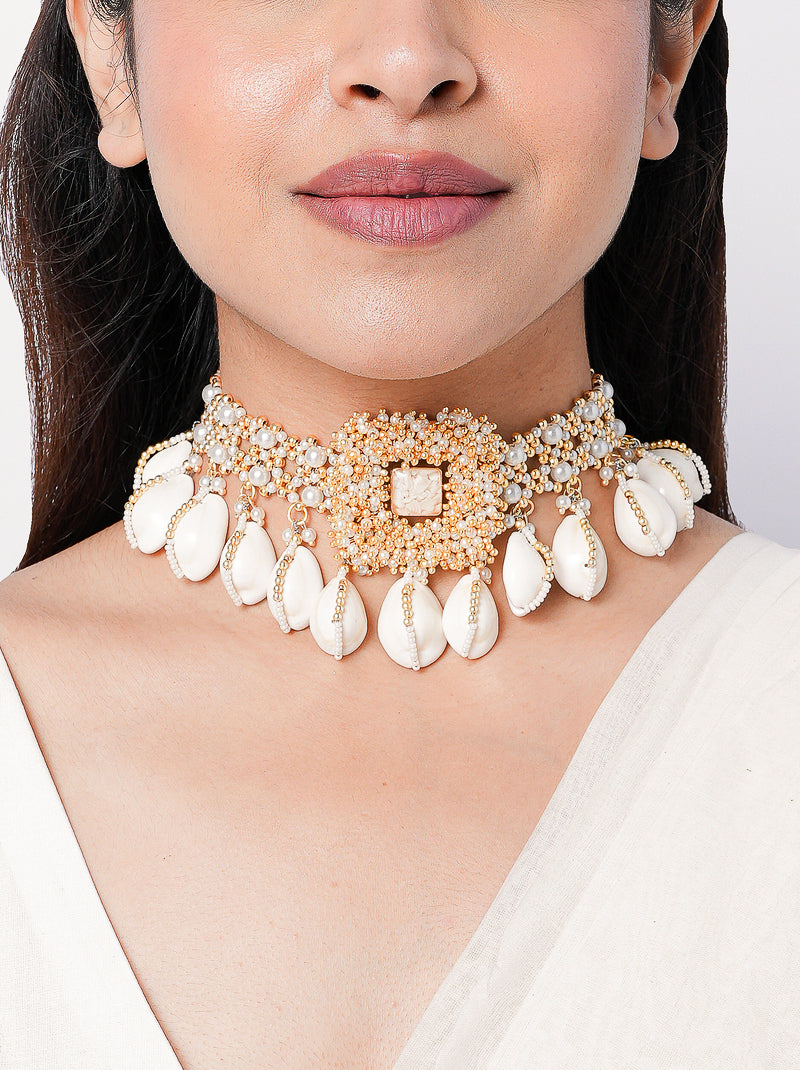Rukmani Choker featuring handcrafted shell motifs, pearl embellishments, intricate bead embroidery, and gold tone detailing, designed for bridal jewelry, wedding styling, festive occasions, mehendi celebrations, and luxury ethnic fashion.
