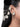 Rupali Shell Earchain Earrings featuring intricate pearl clusters, white seashell details, gold-tone beads and a decorative ear chain, styled on a woman.