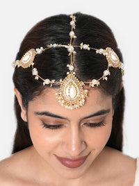Saloni Shell Designer Maathapatti handcrafted with natural cowrie shell motifs, faux pearl strands, intricate glass bead detailing, and a Gold Tone Finish, perfect for bridal entries, Haldi, Mehndi, Sangeet, weddings, receptions, destination weddings, and elegant bridal hairstyles.