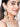 Sanam handcrafted shell statement earrings with pearl, bead and thread detailing in a gold tone finish.