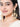 Sayesha Pearl Shell Earrings featuring cowrie shells, faux pearl accents and intricate gold tone detailing for bridal, festive and ethnic wear.