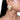 Shyla Haldi Shell Earrings featuring ivory shell motifs, pearl accents and intricate gold-tone beadwork, styled on a woman.