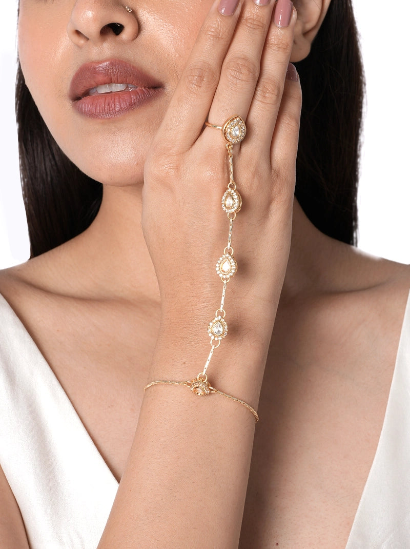 Sia Latest Design Haathphool handcrafted with pear-shaped glass stones, premium brass metal chain detailing, and a Gold Tone Finish, perfect for engagements, weddings, festive occasions, and contemporary bridal styling.