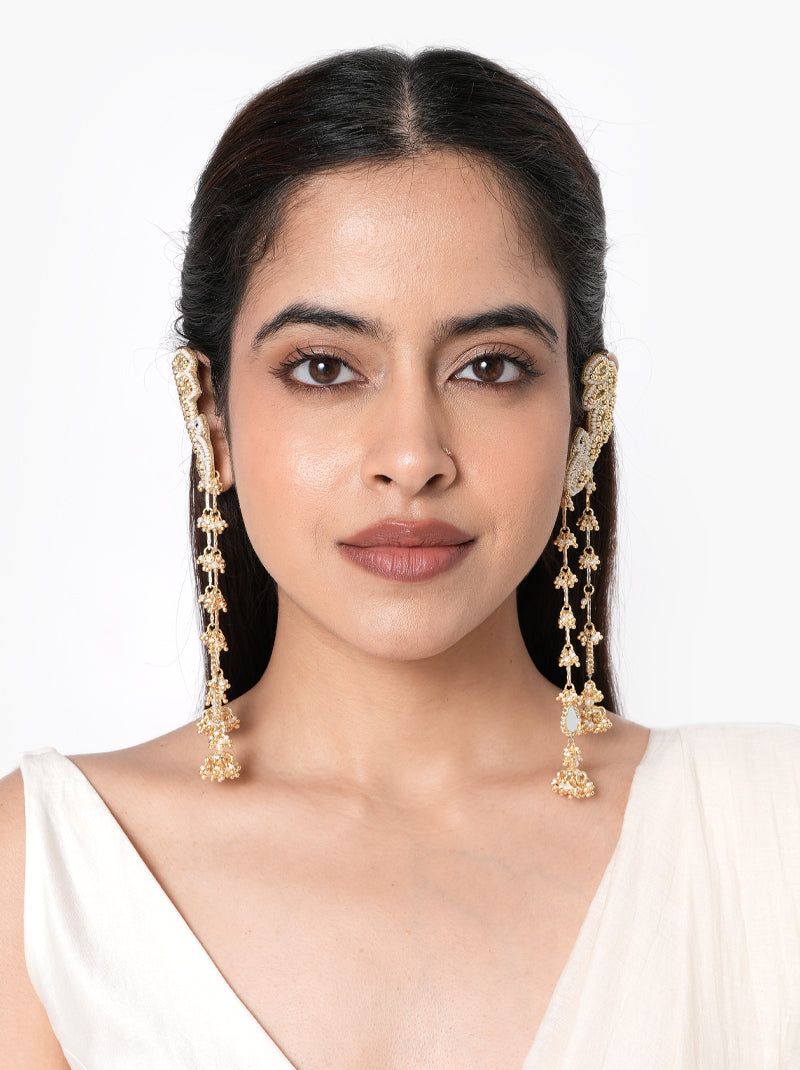 Siddhi Embroidered Tassel Earrings handcrafted with intricate thread embroidery, mirror accents, glass bead detailing, long tassel drops, matching embroidered earcuff, and a Gold Tone Finish, perfect for Haldi, Mehndi, weddings, festive celebrations, receptions, and elegant bridal styling.