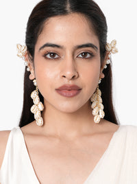 Siddhi Floral Shell Earrings handcrafted with natural shell petals, faux pearls, intricate glass bead embroidery, and a Gold Tone Finish, perfect for Haldi, Mehndi, destination weddings, festive celebrations, beach weddings, and elegant ethnic styling.