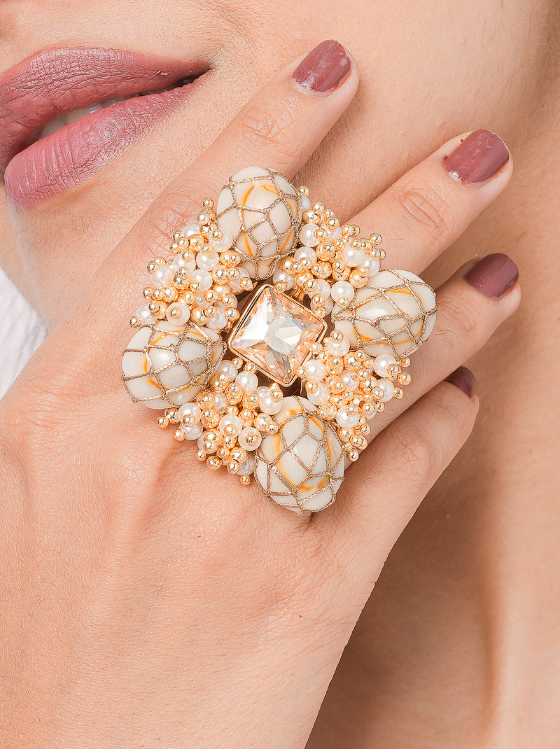 Saboya Bridal Beaded Ring featuring embroidered shell accents, faux pearls, glass stone centerpiece and gold tone finish for bridal and festive wear.