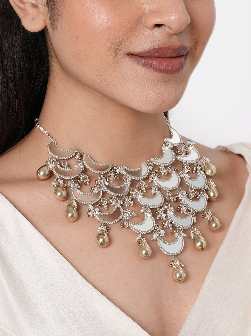 Sofia Mirror Crescent Choker handcrafted with layered crescent mirror motifs, intricate glass bead clusters, metallic drop charms, and a Silver Tone Finish, perfect for Mehndi, Sangeet, weddings, receptions, cocktail parties, festive celebrations, destination weddings, and contemporary ethnic styling.
