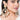 Soma Cowrie Shell Earrings featuring oversized chandbali design, natural cowrie shells, faux pearls, ear chain support, and gold tone finish.