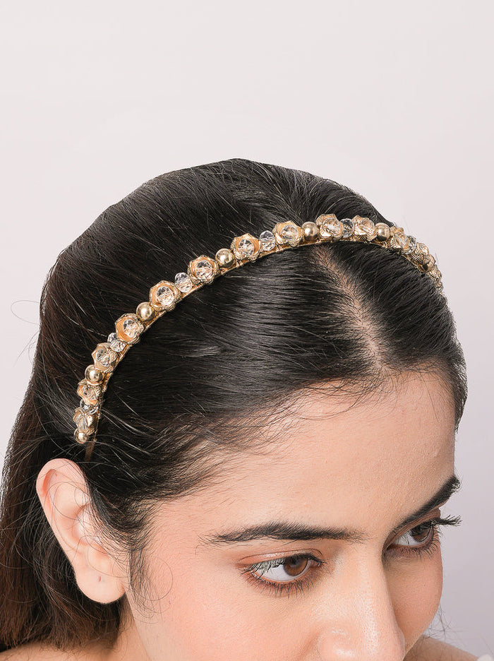 Handcrafted Svara Crystal Bloom Hairband featuring brass metal, floral glass stone detailing and pearl accents with an elegant Antique Finish for bridal and festive hairstyles.