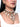 Tia Embroidered Shell Choker featuring layered antique gold-tone chains, embroidered shell embellishments, pearl and bead detailing, dangling shell motifs and an ornate central pendant, styled as a statement Indian jewellery piece.