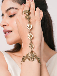 Handcrafted Tisya Heritage Shell Haathphool featuring brass metal, natural shell accents and intricate metal bead detailing with an elegant Antique Finish for bridal and festive wear.