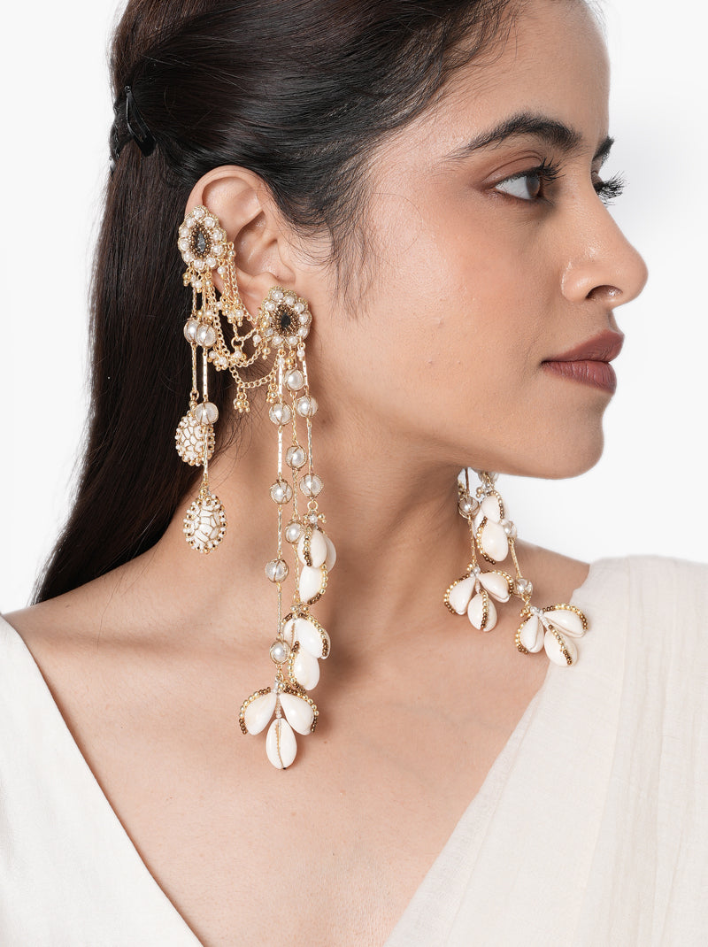 Unnati Fashion Shell Earrings handcrafted with natural shell petals, faux pearls, mirror accents, cascading glass bead chains, and a Gold Tone Finish, perfect for Haldi, Mehndi, destination weddings, beach weddings, festive celebrations, cocktail parties, and luxury ethnic styling.