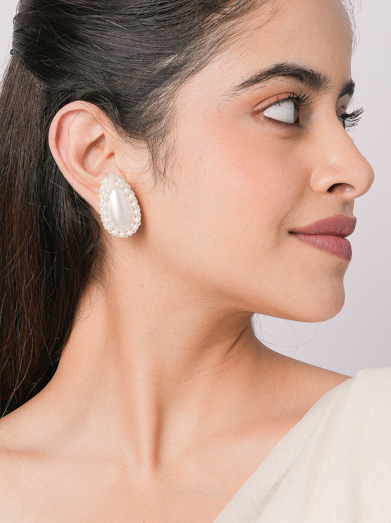 Yana Pearl Oval Stud Earrings handcrafted with an oval faux pearl centre, pearl bead embroidery and a Gold Tone Finish, perfect for everyday elegance, festive wear and weddings.