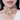 Wania Crystal Pearl Choker handcrafted with pear-cut crystals, baguette stones, intricate pearl embroidery, burgundy bead accents and a luxurious gold tone finish for bridal and festive occasions.