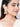 Yug Embroidered Shell Earrings featuring embroidered beadwork, cowrie shell drops, faux pearls and a gold tone finish for bridal and festive wear.
