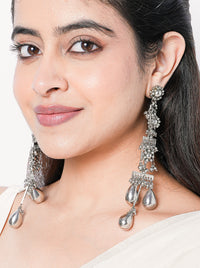 Ziya handcrafted long statement earrings with intricate beadwork and a silver tone finish, ideal for weddings, festive celebrations, and contemporary ethnic styling.