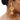 Anbu Statement Ear Cuff featuring mustard thread detailing, faux pearls, glass stone accents, gold-tone finish and cascading pearl tassels for an elegant ethnic look.