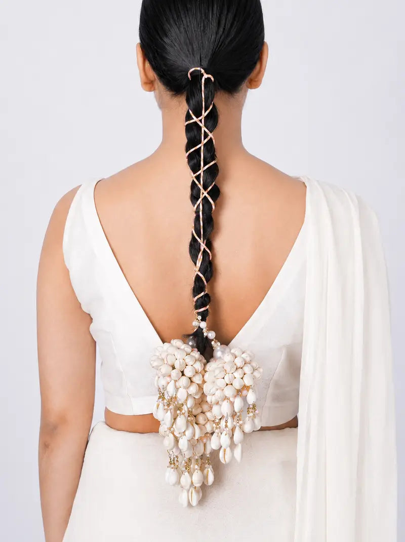 Anvaya Pearl Bridal Parandi handcrafted with clustered faux pearls, cascading pearl drops, decorative brass detailing and a Gold Tone Finish, designed for bridal braids, weddings, mehendi, haldi and festive hairstyles.