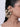 Model wearing Binti Shell Bridal Earchain featuring handcrafted natural shells, faux pearls and layered chain detailing attached from hair to ear in a Gold Tone Finish.