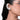 Model wearing Estelle Crystal Halo Earcuff featuring baguette, pear and round crystal stones in a Silver Tone Finish with a curved ear-hugging design.