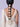 Model wearing Kalindi Pearl Bridal Hairchain featuring handcrafted floral pearl motifs with cascading pearl tassels and gold tone detailing for bridal braid hairstyles.