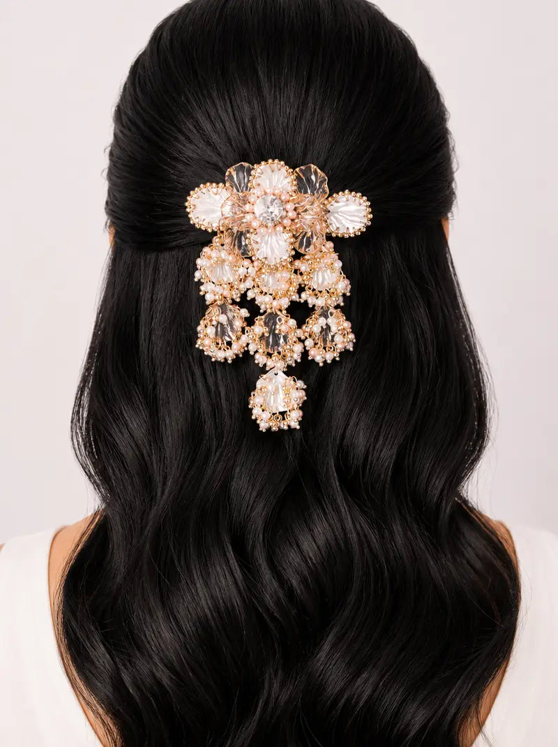 Karvi Floral Pearl Hair Accessory featuring handcrafted floral motifs, crystal stones, faux pearls, translucent petals and a rose gold tone finish, ideal for bridal hairstyles, weddings and festive celebrations.