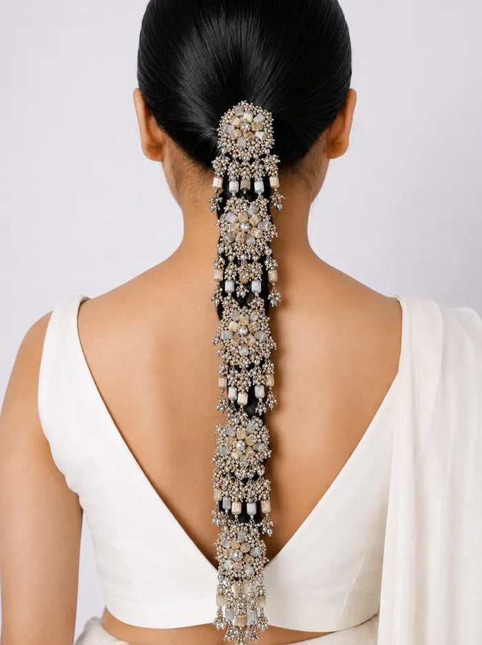 Mohita Bridal Hair Accessory in antique silver finish featuring handcrafted floral crystal motifs and cascading beadwork for elegant bridal braid hairstyles.