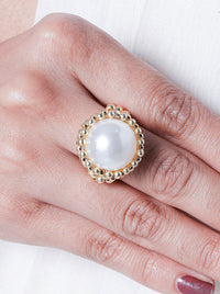 Motichoor Pearl Statement Ring handcrafted with a luminous pearl centerpiece, polished gold bead border, adjustable band, and luxurious 22kt Gold Plating for elegant festive and everyday styling.