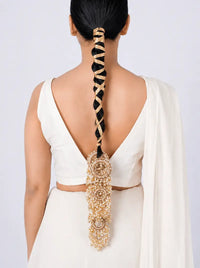 Pallavi Handcrafted Hair Parandi featuring faux pearls, intricate gota work, handcrafted brass detailing and a Gold Tone Finish, designed to elevate bridal braids and festive hairstyles.
