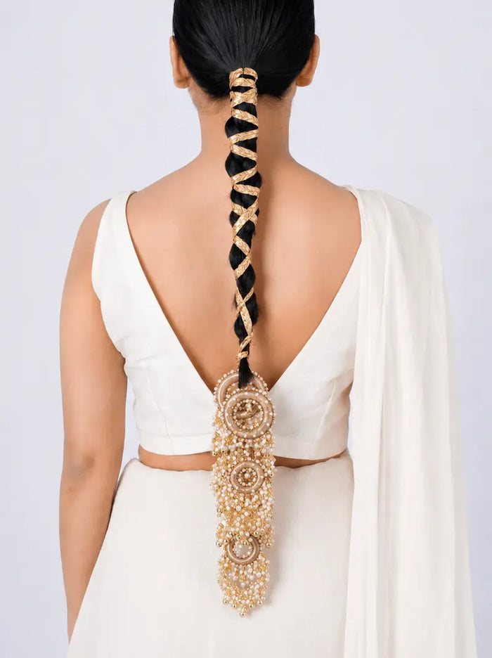 Pallavi Handcrafted Hair Parandi featuring faux pearls, intricate gota work, handcrafted brass detailing and a Gold Tone Finish, designed to elevate bridal braids and festive hairstyles.