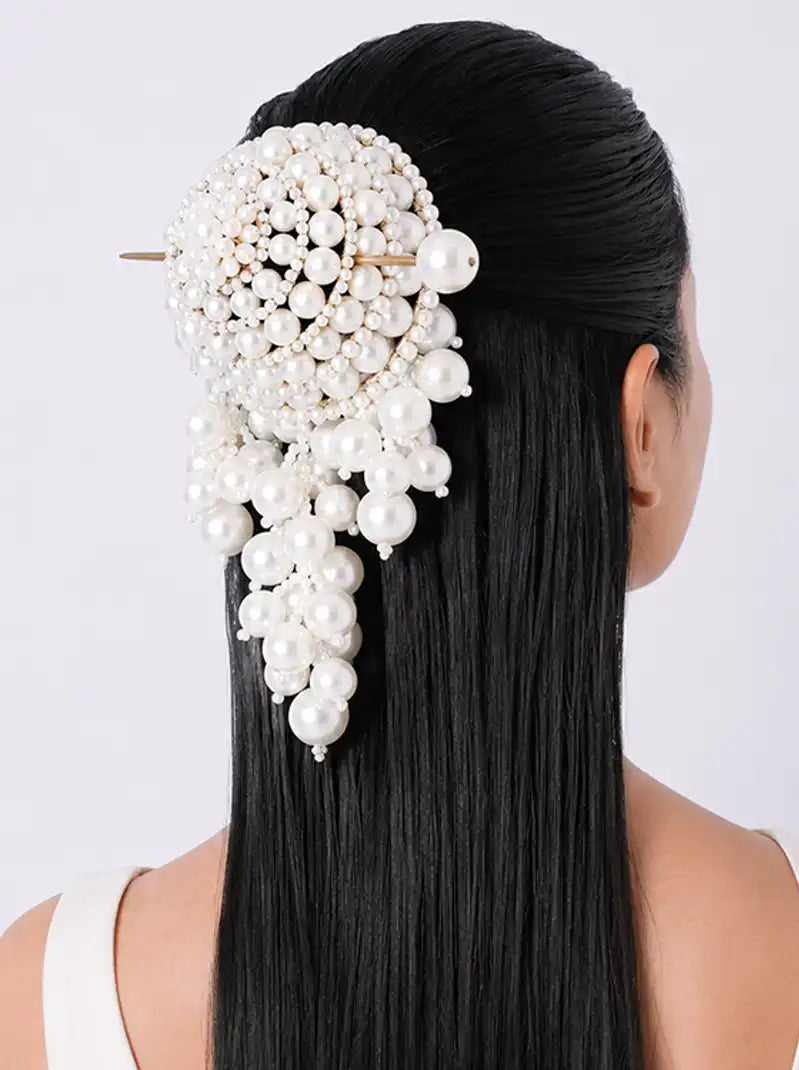 Parna Pearl Bridal Hair Bun Stick featuring a handcrafted floral pearl design with cascading pearl clusters and a decorative pearl-tipped hair stick for bridal and festive hairstyles.