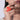 Model wearing Polka Pearl Statement Ring featuring a bold coral red abstract design with faux pearl accents and an adjustable handcrafted statement band.
